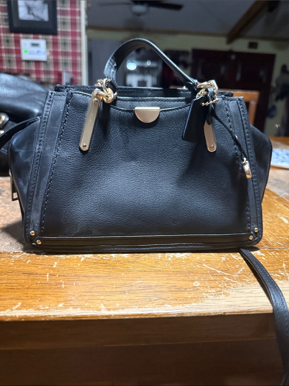 Coach Black Leather Satchel with Gold-Tone Hardware perfect for your evening out